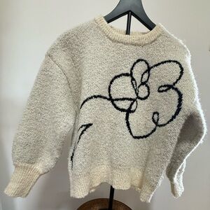 Elegant Cream Sweater with Artistic Floral Pattern